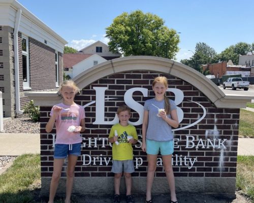 Children in front of lsb sign